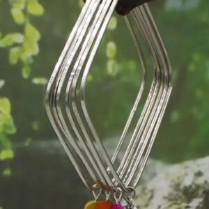 Silver bangle with charms